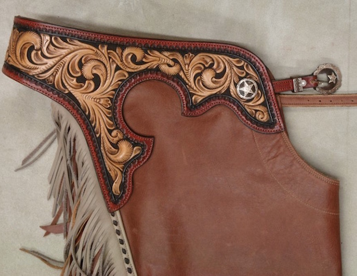 Reining Chaps with full tooled tops, tai-colored dye.